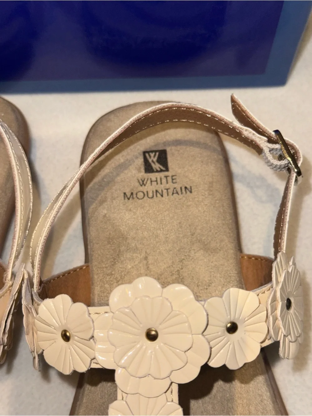 White Mountain Liftoff Flat Sandals feature delicate floral applique on T-strap